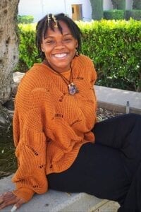 woman with dreadlocks posing for a picture